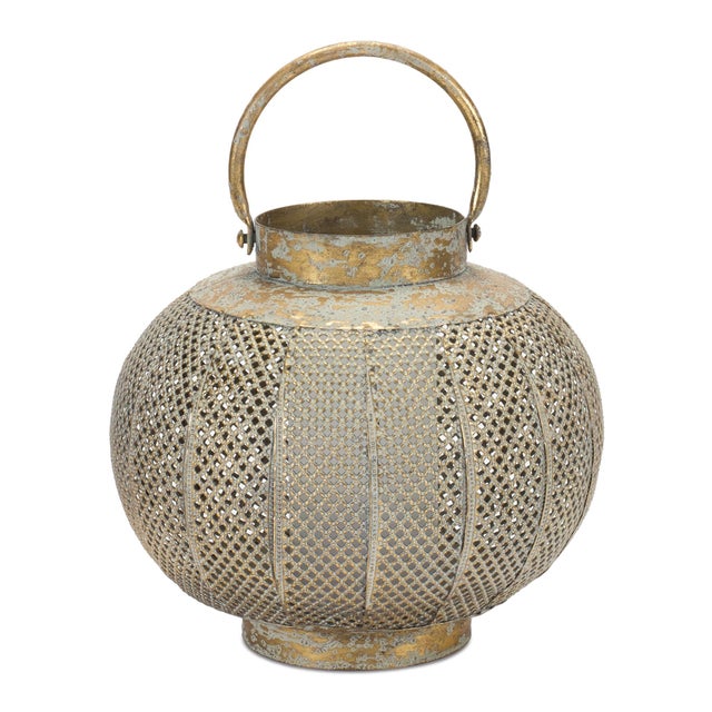 Illuminate your home with bohemian elegance! This Distressed Punched Metal Lantern features a stunning copper and green...