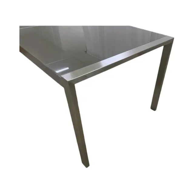 This is a Brueton high table, the Custom Stainless Steel Table w/ Gray Frosted Glass. The table has two frosted panes of...