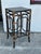 Boho chic pair of stands or tables crafted in wood in a faux bamboo technique with Rattan highlights. Sign on a label...