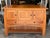 Design Plus Gallery presents the larger Aspen Open Sideboard with Inlay by Simply Amish. Constructed in cherry wood, the...