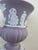 Showcasing timeless beauty and classic craftsmanship, this Wedgwood Jasperware Grecian vase features a lovely lilac...
