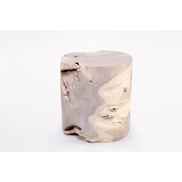 Inspired by the beauty of natural root form, this organic teak accent side table is handcrafted from one piece of salvaged...