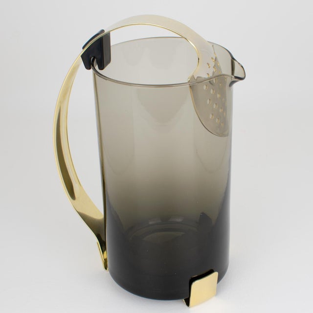 This is a stunning Italian mouth-blown glass cocktail pitcher crafted circa 1960. This beautiful smoke-gray glass mixer...
