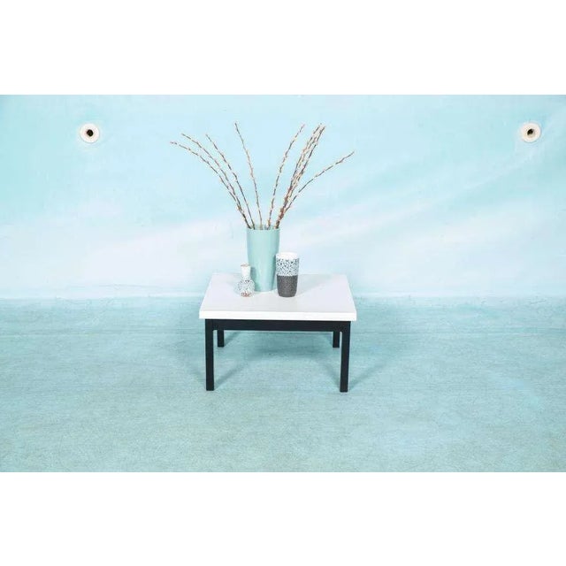 Sleekly designed compact coffee table from the sixties in the style of Friso Kramer. Due to the materials used, it can...