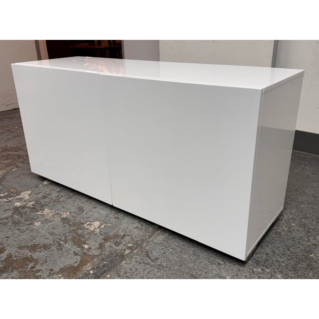 Design Plus Gallery presents the Fuel White Credenza from CB2. The low-profile storage piece has a streamlined rectangular...