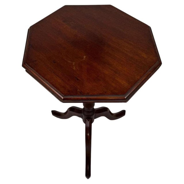 An elegant 19th-century English side table, finely crafted from mahogany and distinguished by its beautifully shaped...