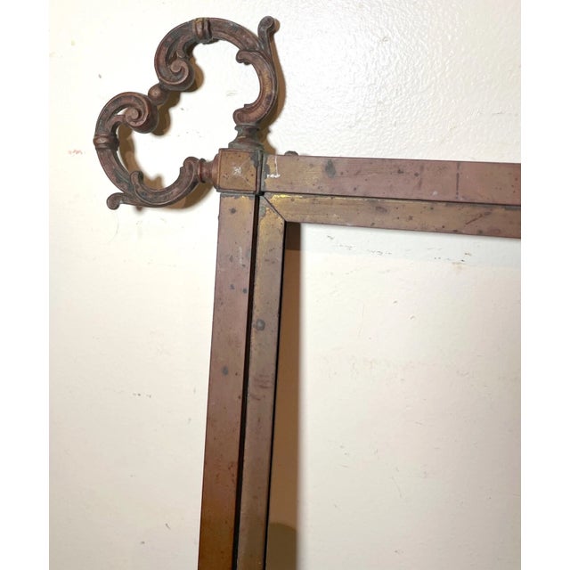 This 19th century antique wall mirror is a stunning piece of Victorian style. The bronze material is adorned with ornate...