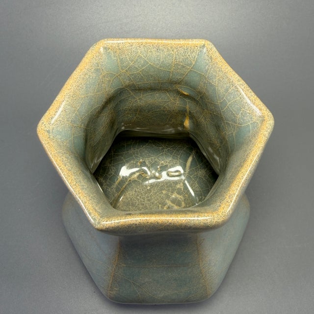 Classic Chinese official‑style celadon hexagonal porcelain vase, crafted with angular faceted body and flared neck. Soft...