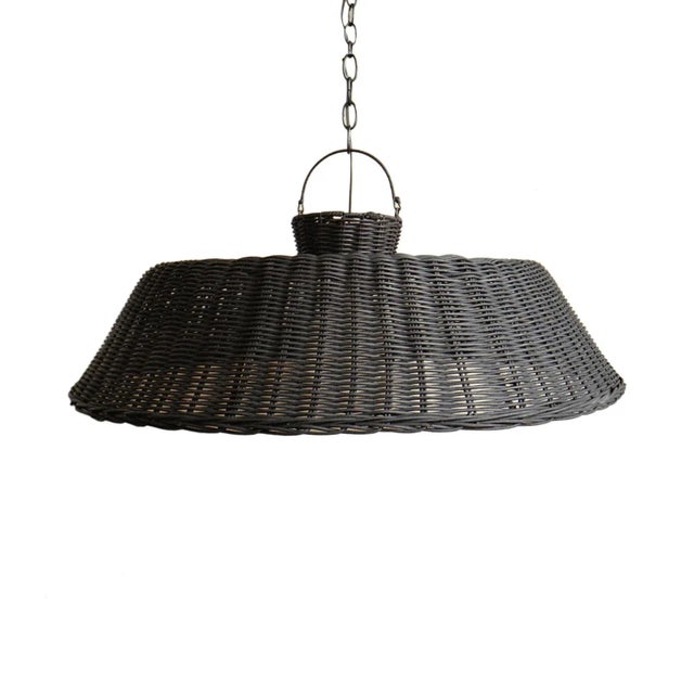 Modern hand woven black stained wicker pendant light. Wonderful on its own or in groupings. Each may be slightly unique in...
