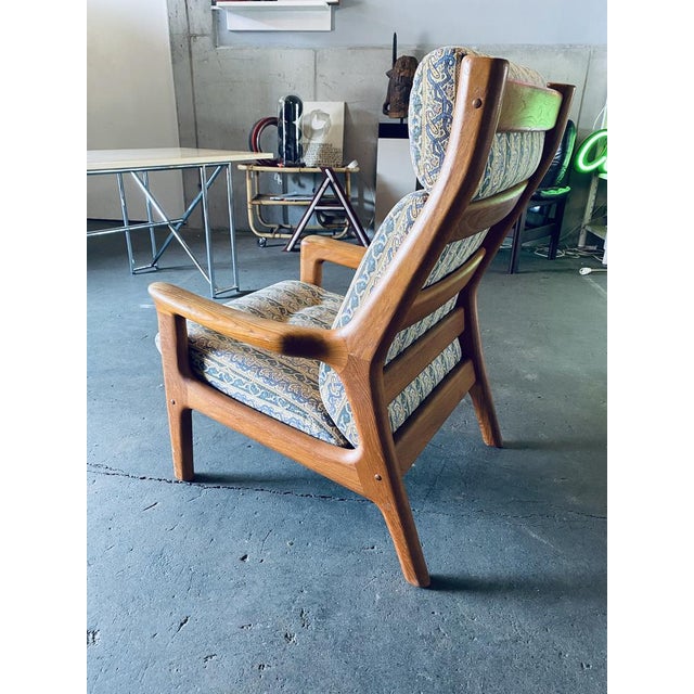 Danish Mid-Century Teak High Back Lounge Chair by Gustav Thams. The designer chair is designed as a high-backed chair and...