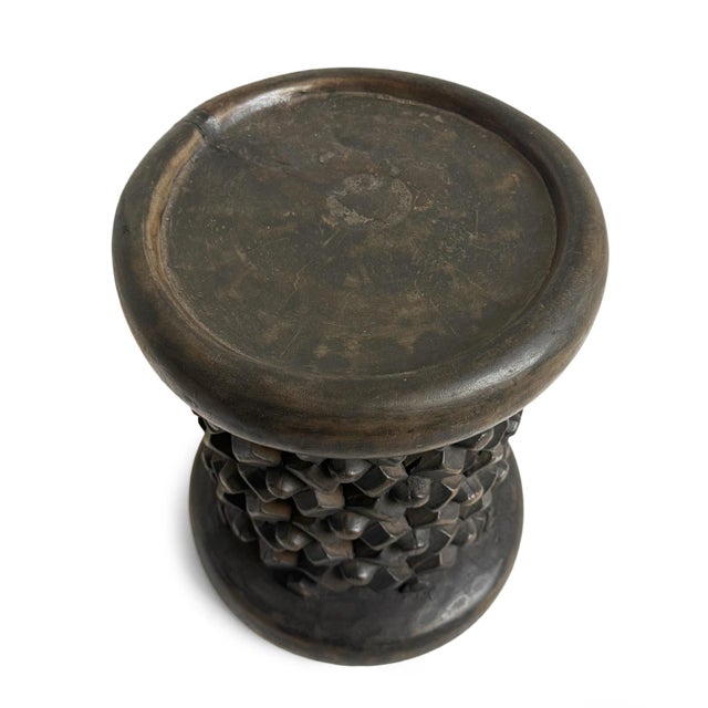 Authentic hand carved Bamileke tribal wood stool. Masterfully crafted from one piece of indigenous wood. Impressive and...