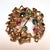 Modernist openwork brooch in 9k gold set with sapphires, pink sapphires, and emeralds (Diameter: approximately 4.2 cm)....