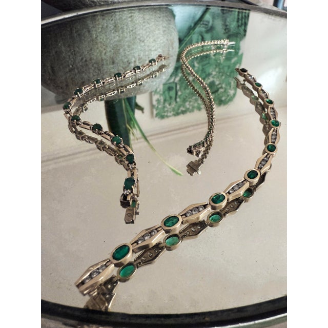 Vintage Michael Anthony 14K yellow gold emerald and diamond bar-link tennis bracelet, approximately 7 inches long and...