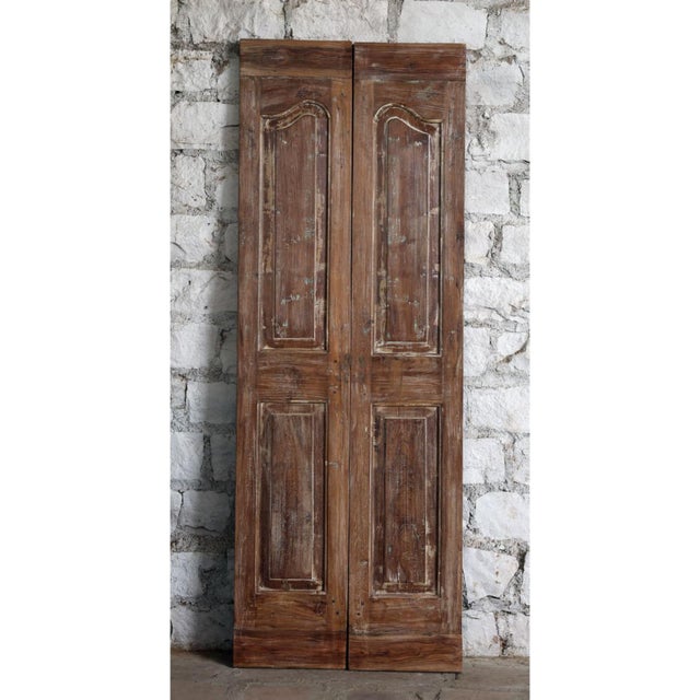 Bring timeless character and artisanal beauty into your space with this pair of vintage floral carved double doors,...
