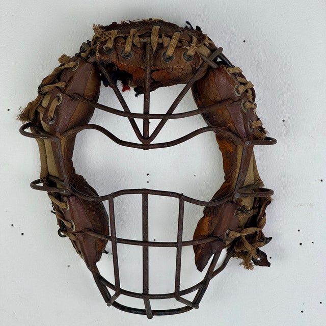 For decorative purposes and for sports memorabilia fans, an early 20th Century baseball face mask. A lot of these had...