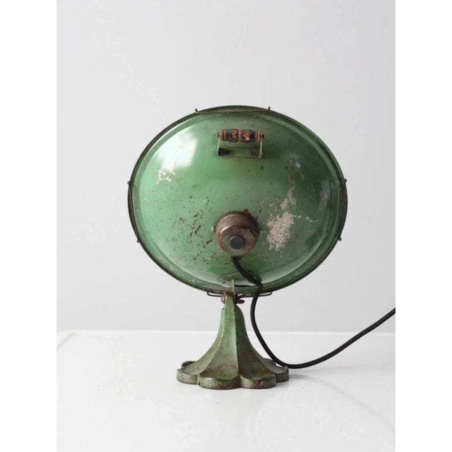This is a vintage Electrahot Mfg Co reflector heater circa 1930s - 1940s. The electric space heater features a green cast...