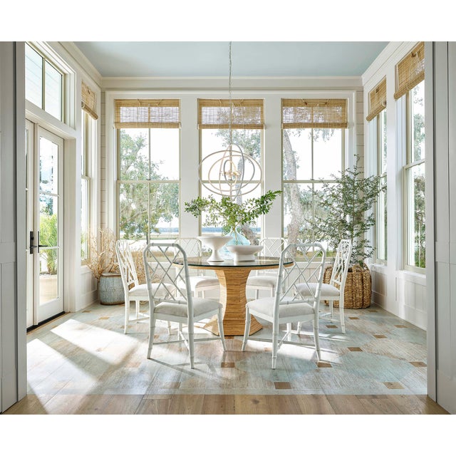The minimalist form of this chandelier is reminiscent of a boat's sails and provides a casually elegant silhouette for any...