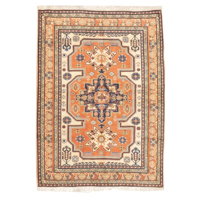 Vintage hand-knotted Persian Ardebil rug with a geometric medallion design set within an ivory and orange field. Stylized...
