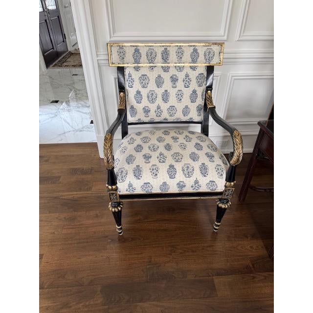 Regency style chair from Highland House in perfect condition. Black lacquered wood with gold leaf/gilt accents. Arm...