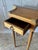 A French Louis XVI style console table featuring a serpentine front with curved sides, pierced bronze gallery, and a...