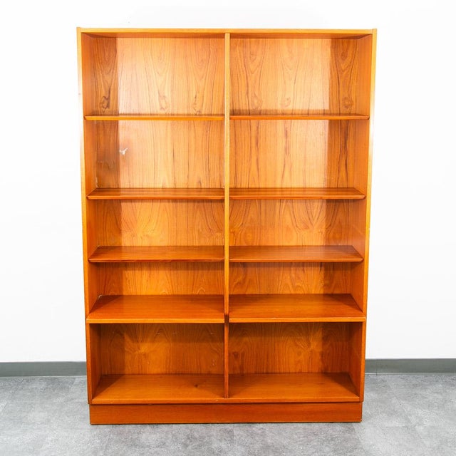 Poul Hundevad teak bookshelf with adjustable shelving throughout. The grain on the sides and shelving is outstanding and...