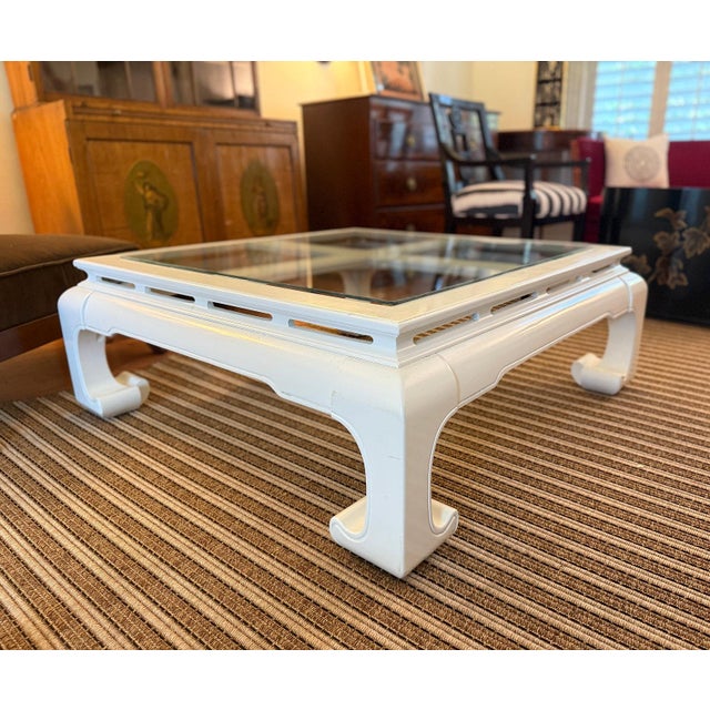 Gorgeous vintage, Ming-style coffee table with chow legs in glossy white lacquer. Dimensions: 41.0" W x 14.5" H x 41.0" D...