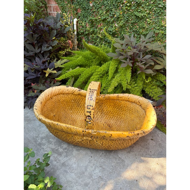 This generous folk art basket features mustard yellow paint with a fixed handle that was hand lettered “The Lady Jane...