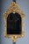 Venetian Baroque Wall Mirror, Ornately Gilded, 19th Century The frame is made of hand-carved wood, finished with gold...