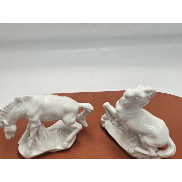 Porcelain horse figurine, 1970, dimensions: height of the highest 14 cm, width 11.5 cm, depth 4.8 cm. smaller figurine:...