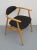 Elegant 60s Armchair, Sleek frame in Bähe bright. The seat and back is newly upholstered and freshly made in black...