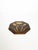 An elegant hexagonal carved wooden trivet, featuring a stylized floral design of three blooming tulips. Its flowing lines...