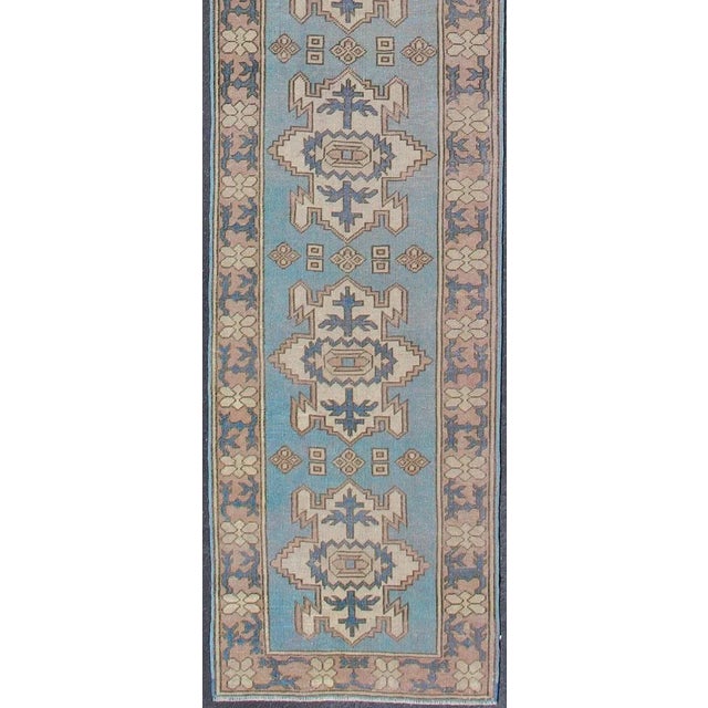 Long vintage Turkish runner with geometric design in light blue and taupe Vintage Oushak runner from Turkey with Medallion...