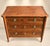 A louis xvi style commode, stamped "gaston boulay 1984," crafted from solid cherry wood with an oak back. it features four...