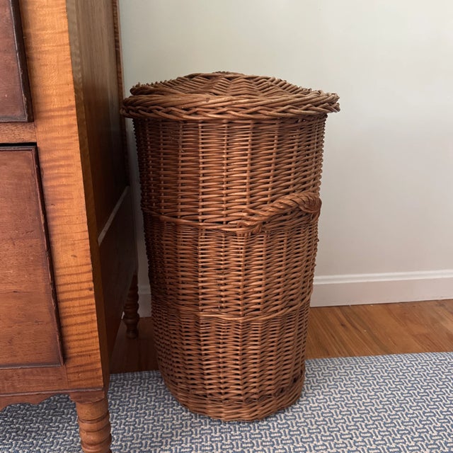Listing is for a vintage French wicker oval basket with handles and lid.