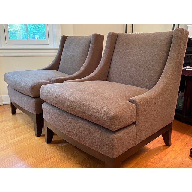 This pair of "Starlet" lounge chairs comes from the Barbara Barry collection for Henredon. Upholstered in a textured brown...
