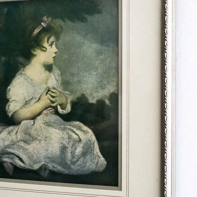 This framed print of “Age of Innocence”, one of Sir Joshua Reynolds’ most beloved portraits, captures the serene innocence...