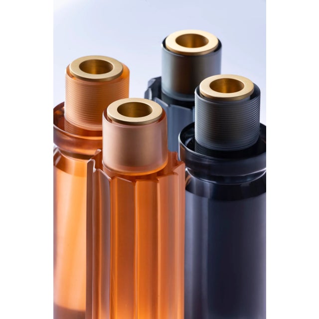 COLORS AVAILABLE: Crystal + iris grey / steel + crystal / rose + iris. Lume is a blown glass and satinated brass...