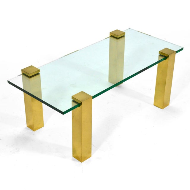 This handsome and versatile minimalist design has four brass legs which attach via pressure to a glass top. They can be...