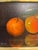 Original Antonio Gusini (b. 1901) painting. Known for his dramatic chiaroscuro style, Gusini renders two vibrant oranges...
