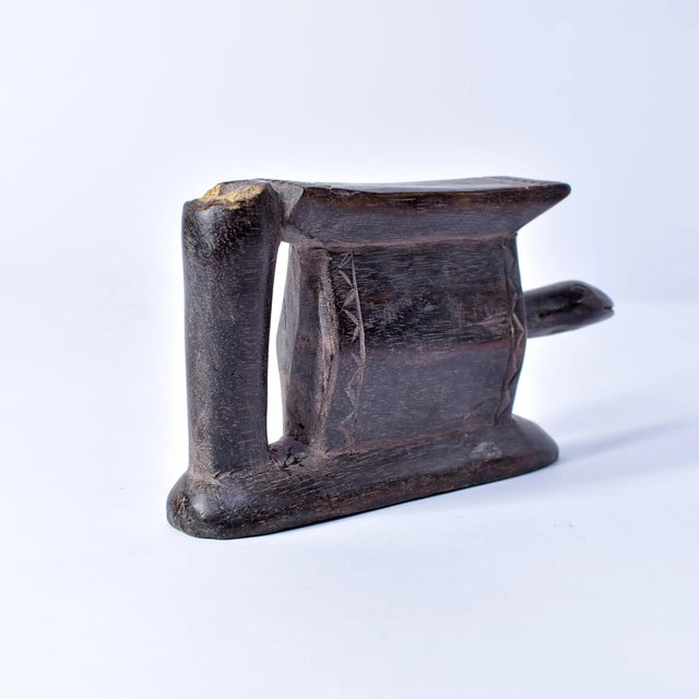 This elegant headrest originates from the Baule people of CÃ´te d'Ivoire (Ivory Coast), renowned for their refined...
