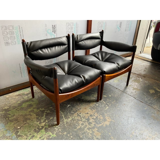 A settee comprised of two individual armchairs featuring one arm each—here we have the Modus system by Kristian Vedel for...