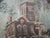 Folk Art Architectural Painting Framed in Antique Stove Pipe Collar for your consideration. The stove pipe collar frame...