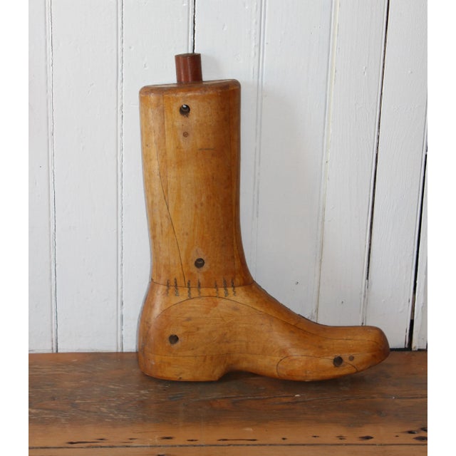 Beautifully crafted antique cobbler's boot form. Circa early-mid twentieth century. Solid and weighty, this is a beautiful...