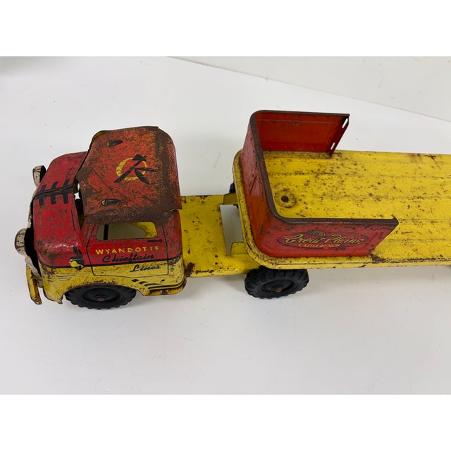 Vintage Wyandotte Chieftrain Lines pressed steel toy truck with Great Plains Cattle Ranch graphics. Features a red and...