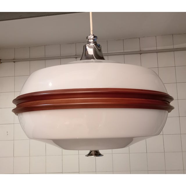 Esperia Serafino chandelier, in acrylic glass and wood, produced in the 1960s. I have official proof of authenticity such...