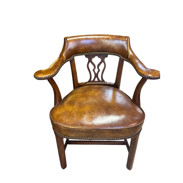 Richly appointed and timeless, this handsome traditional library armchair combines classic English styling with luxurious...