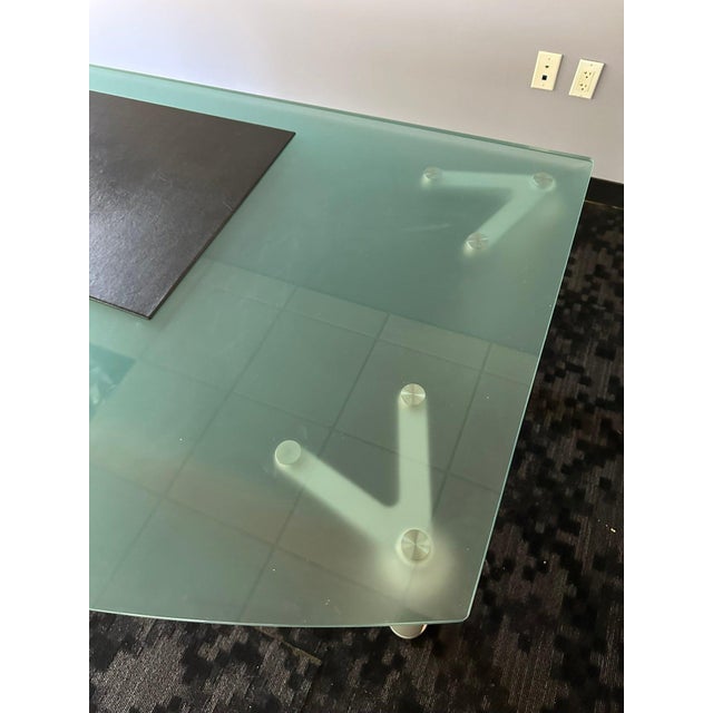 Command attention and inspire productivity with this Executive Glass Top Desk with Privacy Panel—a bold fusion of...