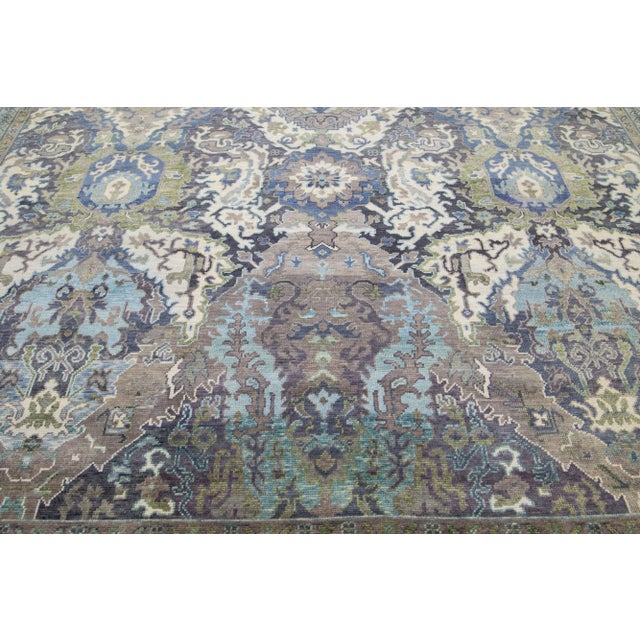 Beautiful modern Oushak hand-knotted wool rug with a gray field. This Turkish rug has a green-designed frame with blue and...