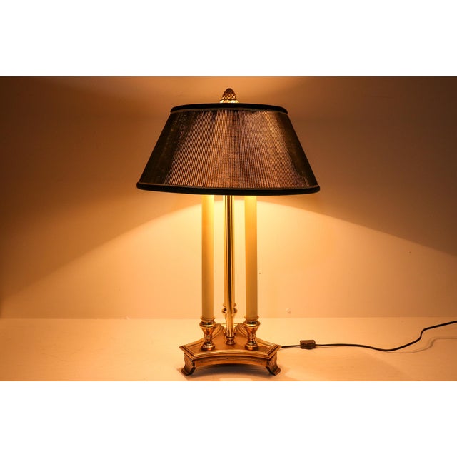 A striking antique French Empire style bouillotte lamp with the layered, collected character associated with classic Ralph...