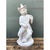 This vintage whimsical ceramic figure depicts an anthropomorphic monkey musician, seated with one leg crossed casually...